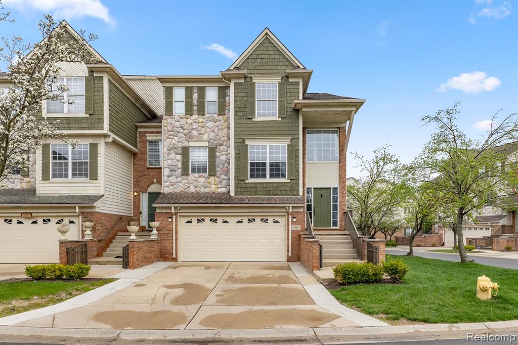 Fall in love with this Bradford Village end unit! Imagine bright, open living, relaxing by the double-sided fireplace, and enjoying your balcony. Spacious bedrooms, updated kitchen, and a versatile walk-out lower level await. Your dream home?